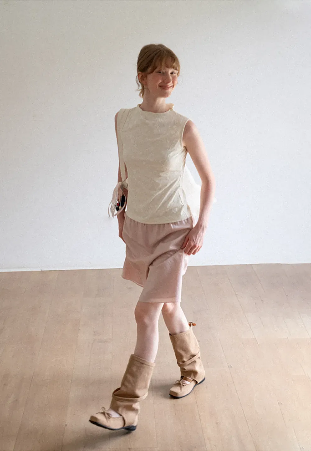 Textured Sleeveless Top with Asymmetrical Hem