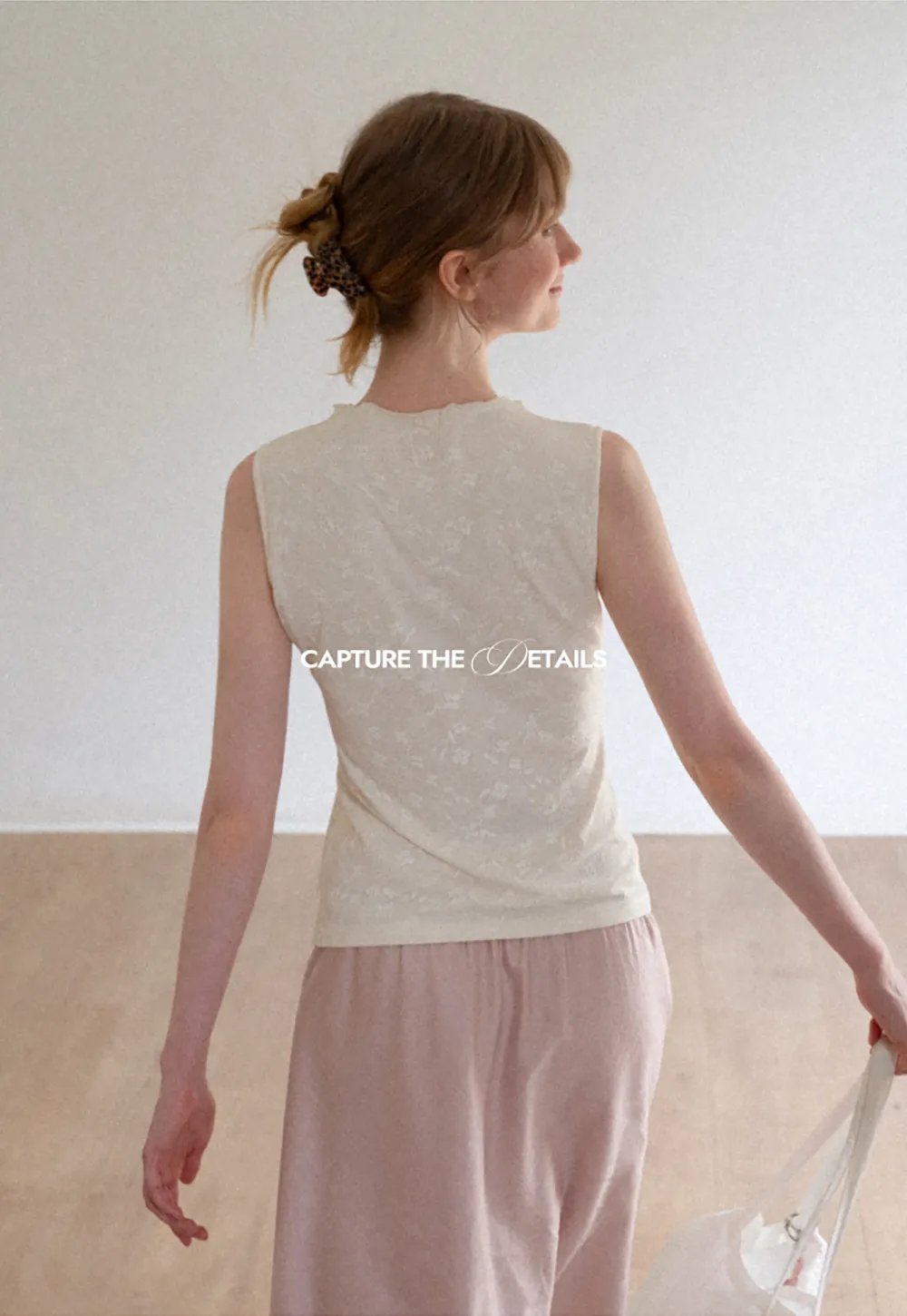 Textured Sleeveless Top with Asymmetrical Hem