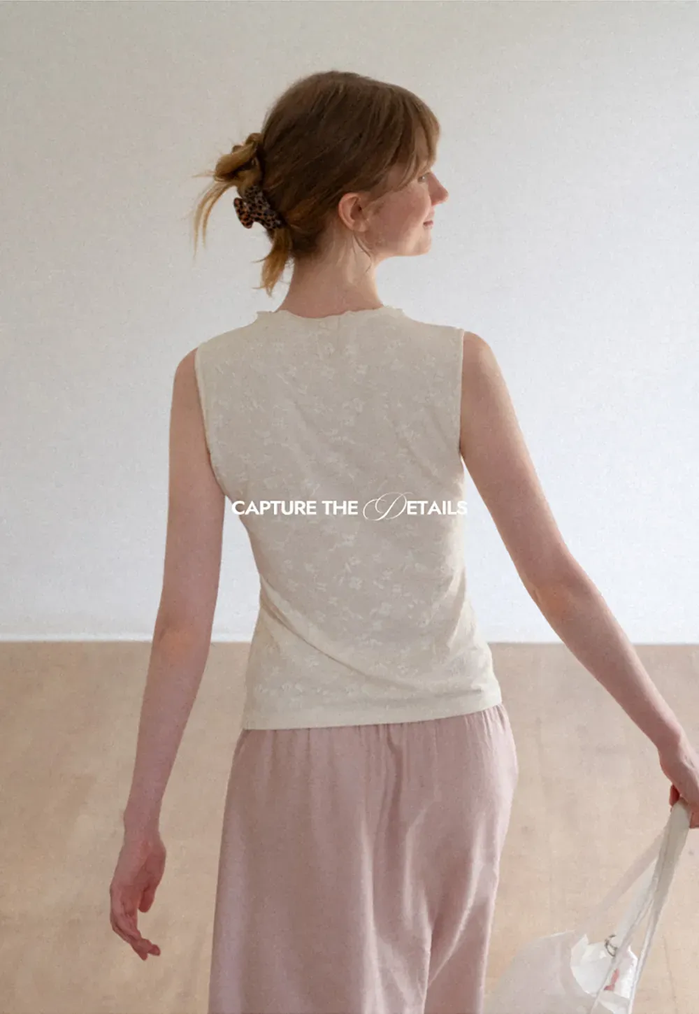 Textured Sleeveless Top with Asymmetrical Hem