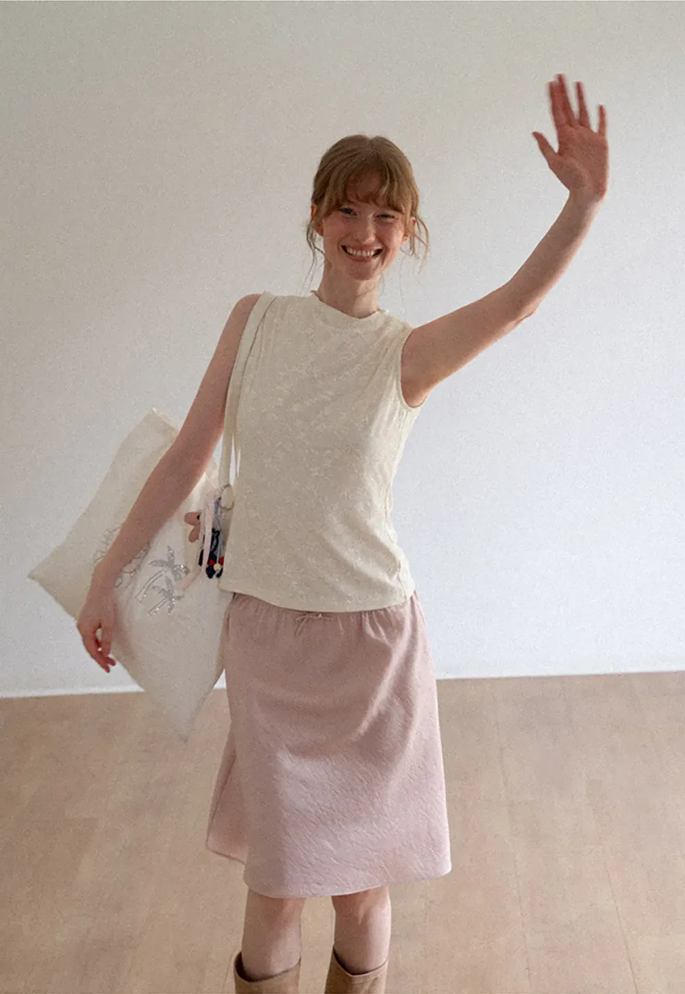 Textured Sleeveless Top with Asymmetrical Hem