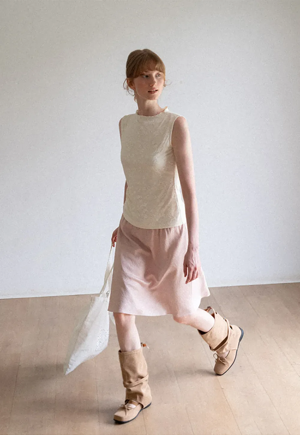 Textured Sleeveless Top with Asymmetrical Hem