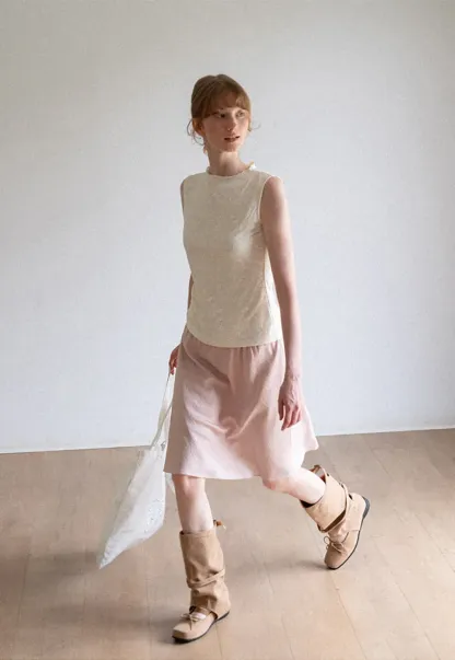 Textured Sleeveless Top with Asymmetrical Hem