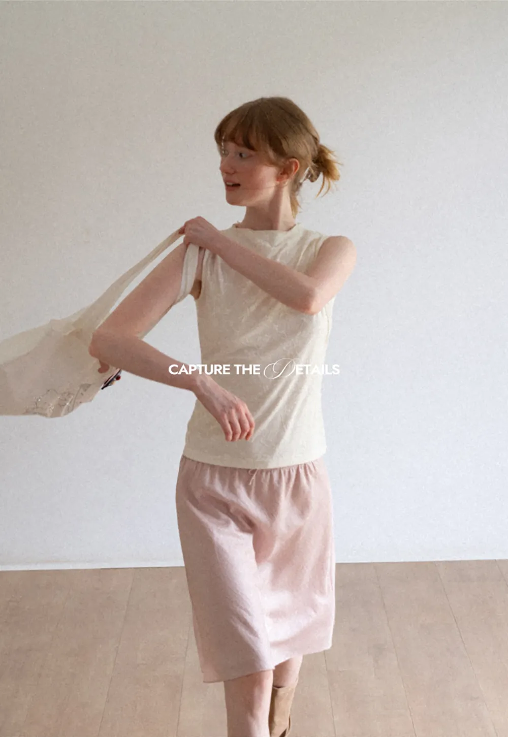 Textured Sleeveless Top with Asymmetrical Hem