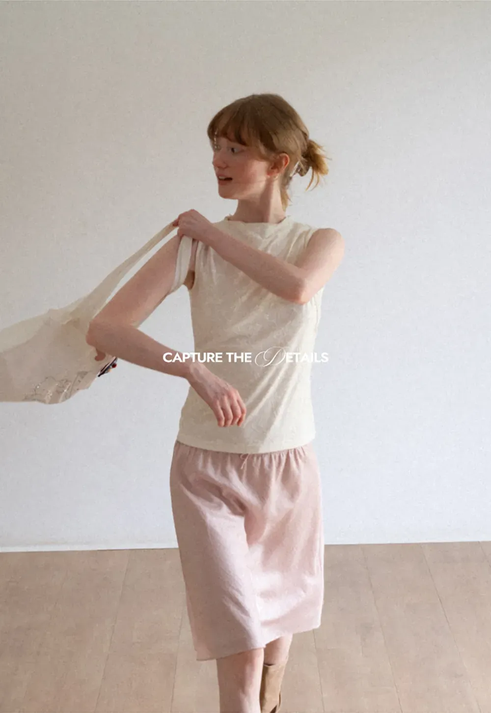 Textured Sleeveless Top with Asymmetrical Hem