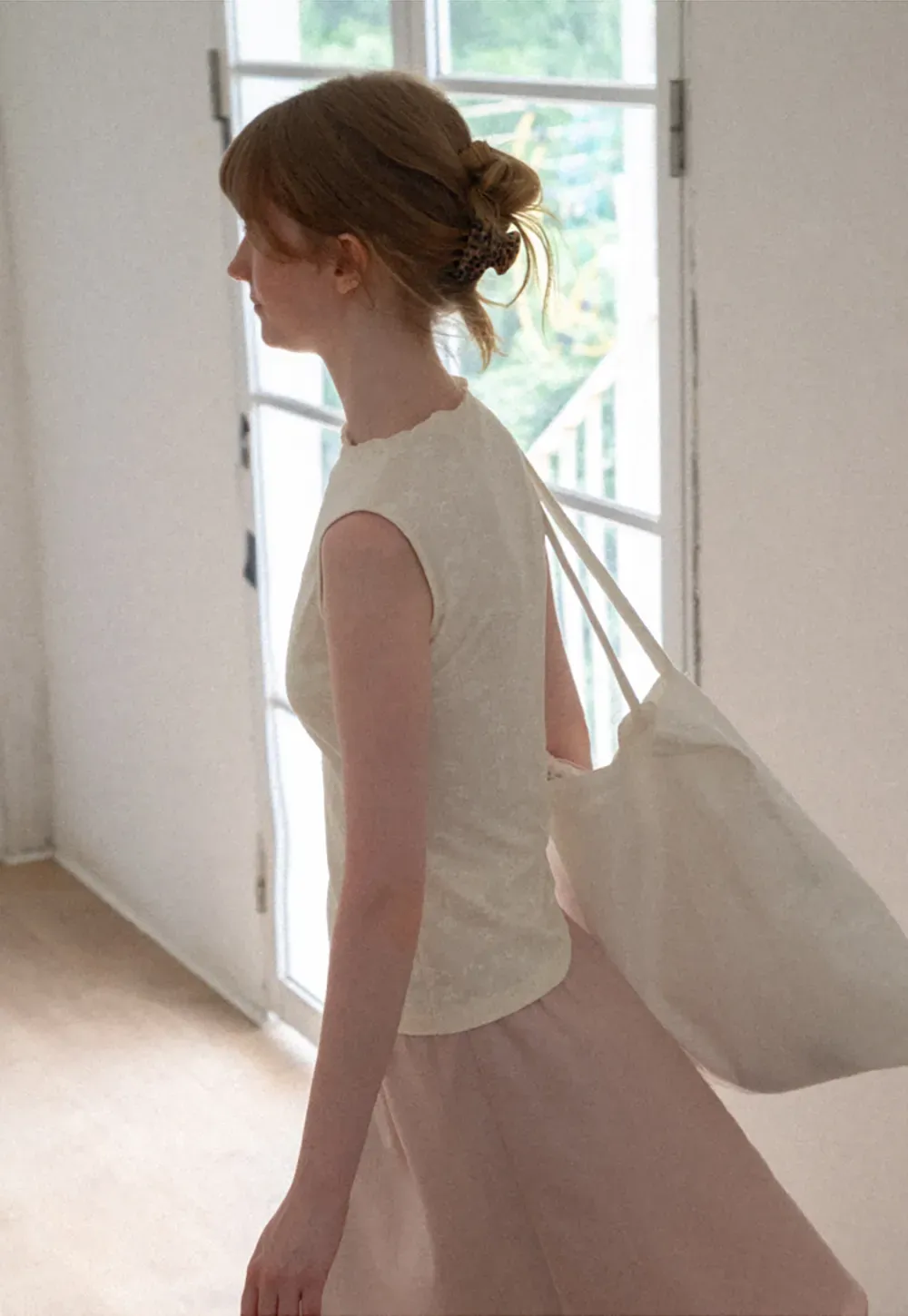 Textured Sleeveless Top with Asymmetrical Hem