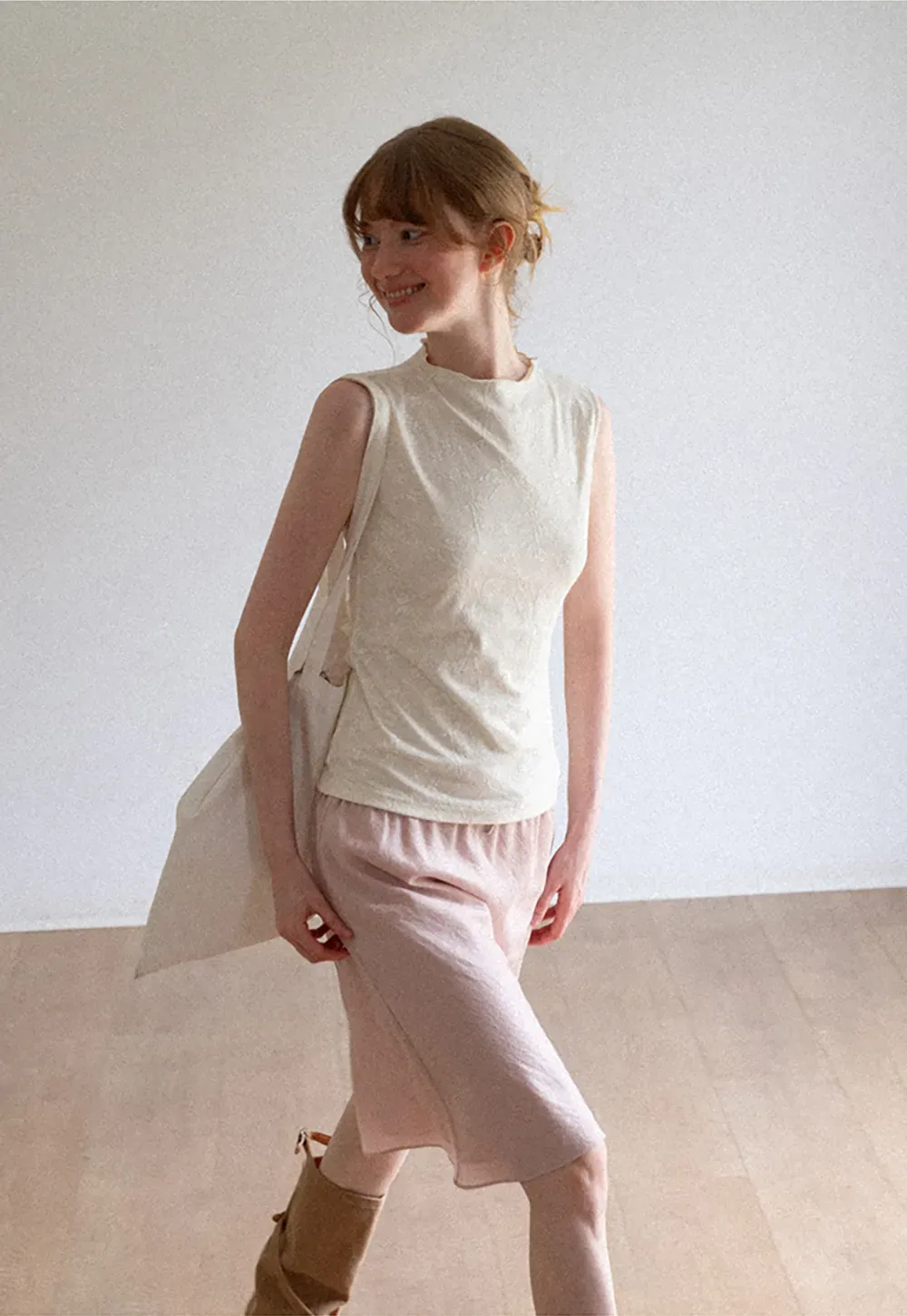 Textured Sleeveless Top with Asymmetrical Hem