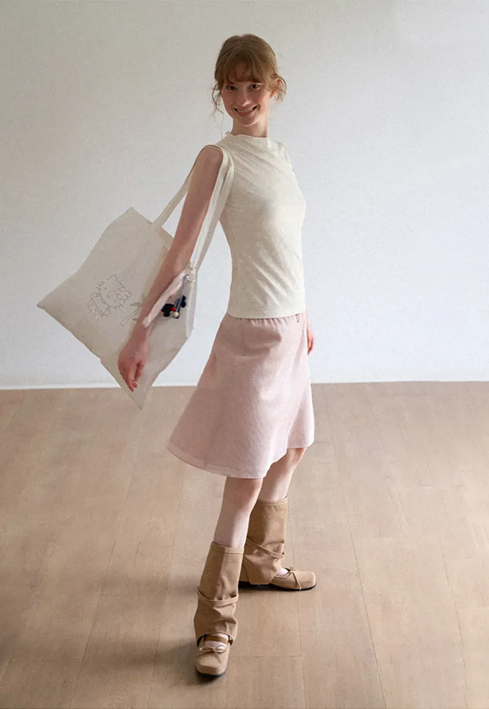 Textured Sleeveless Top with Asymmetrical Hem
