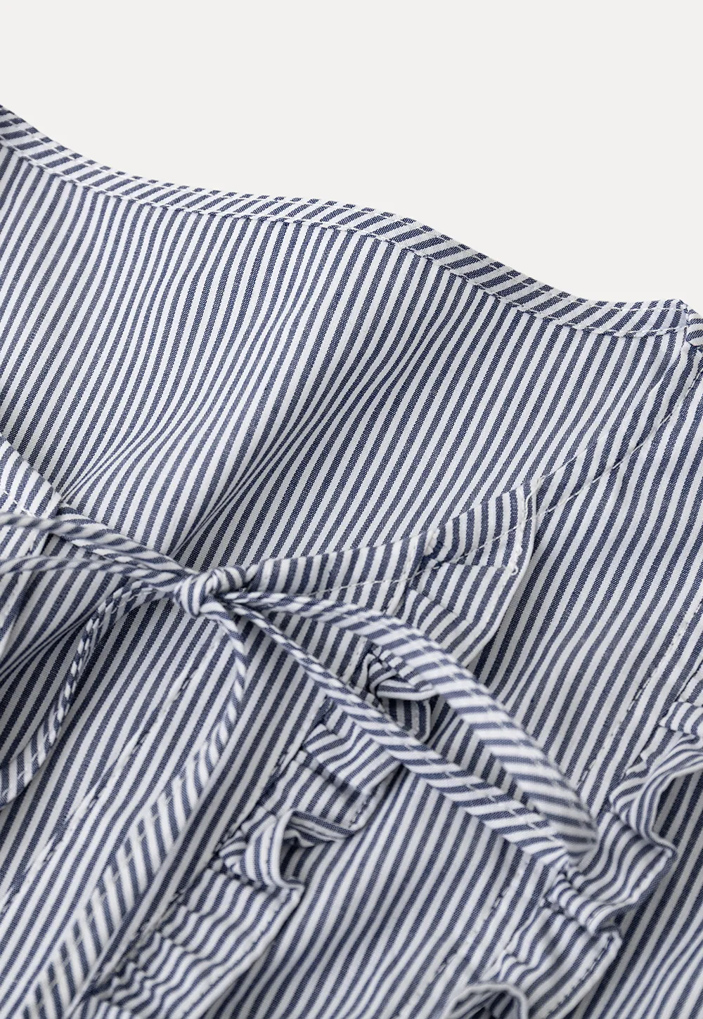 Striped short sleeve shirt with ruffles and tie front