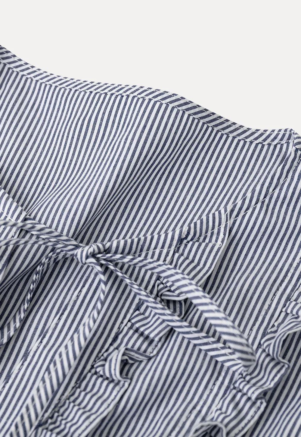 Striped short sleeve shirt with ruffles and tie front