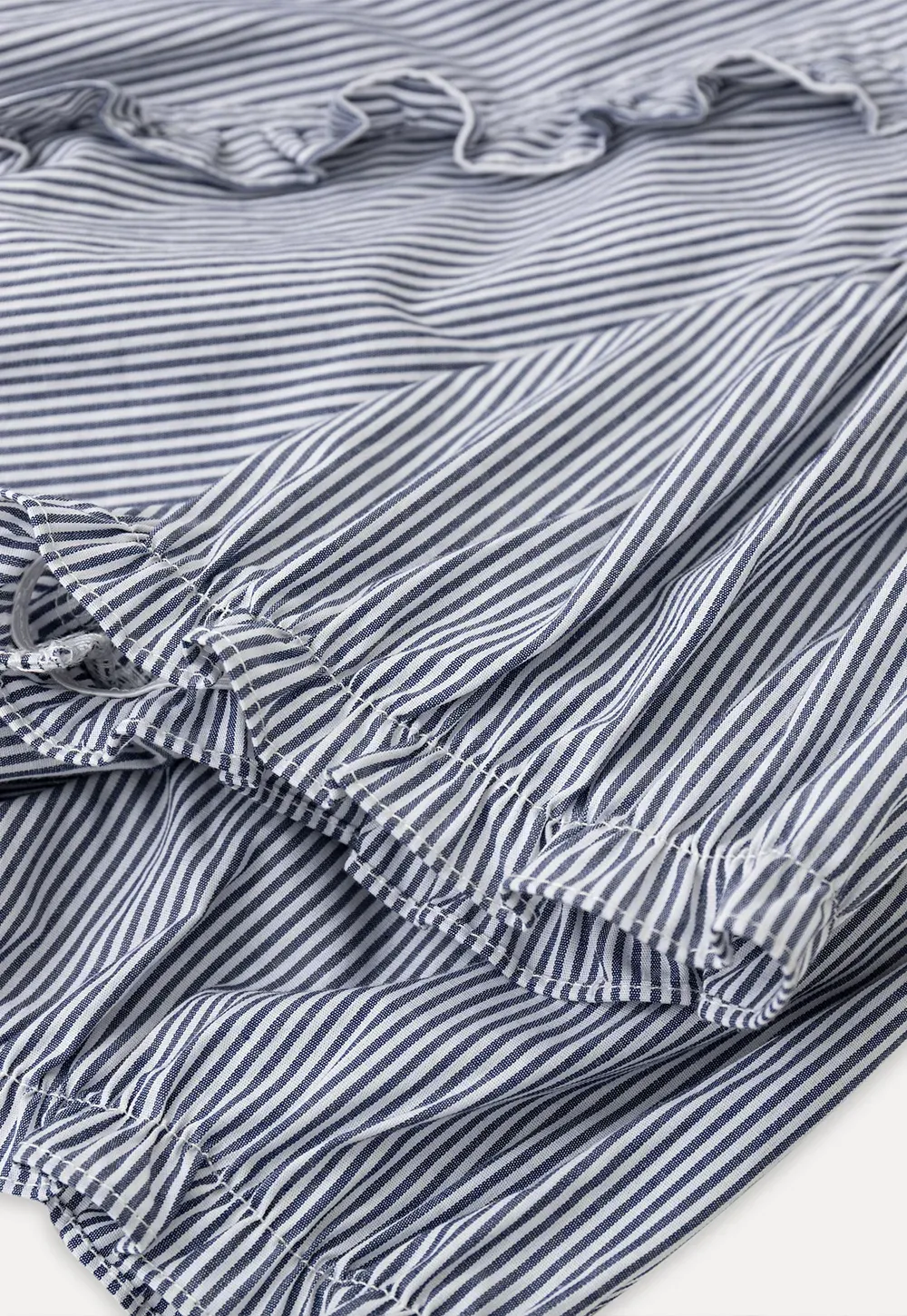 Striped short sleeve shirt with ruffles and tie front