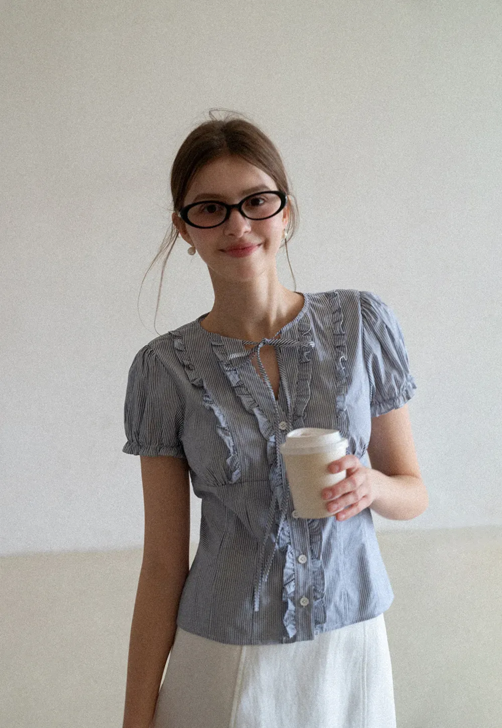 Striped short sleeve shirt with ruffles and tie front