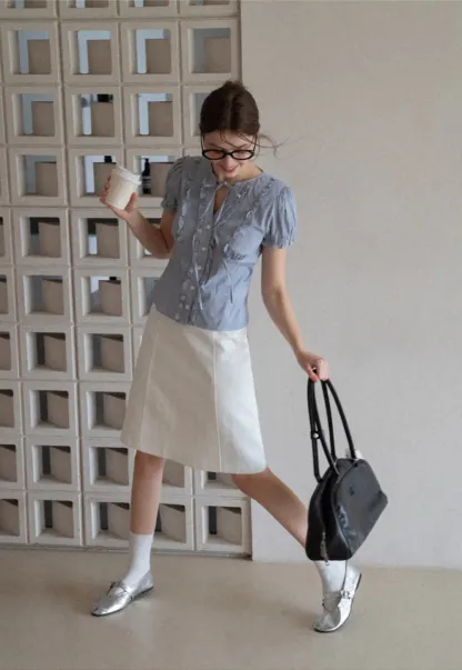 Striped short sleeve shirt with ruffles and tie front