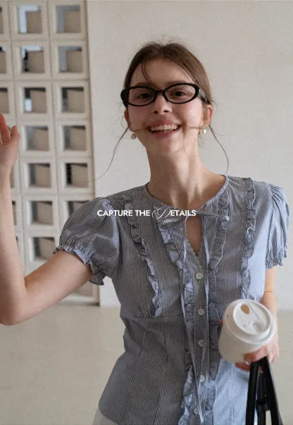 Striped short sleeve shirt with ruffles and tie front