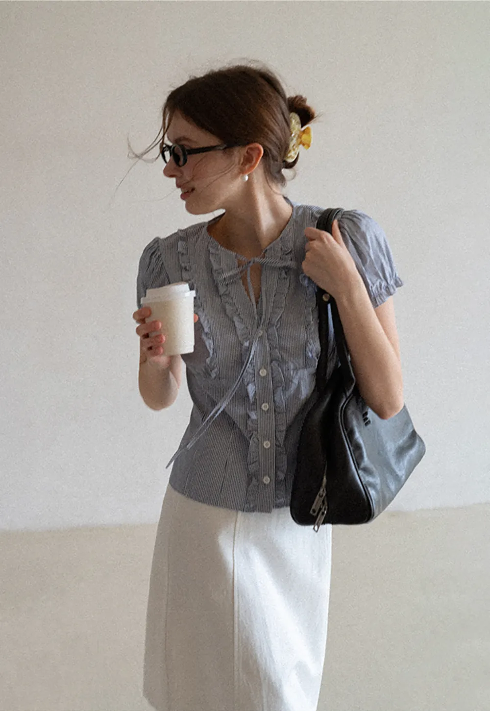 Striped short sleeve shirt with ruffles and tie front