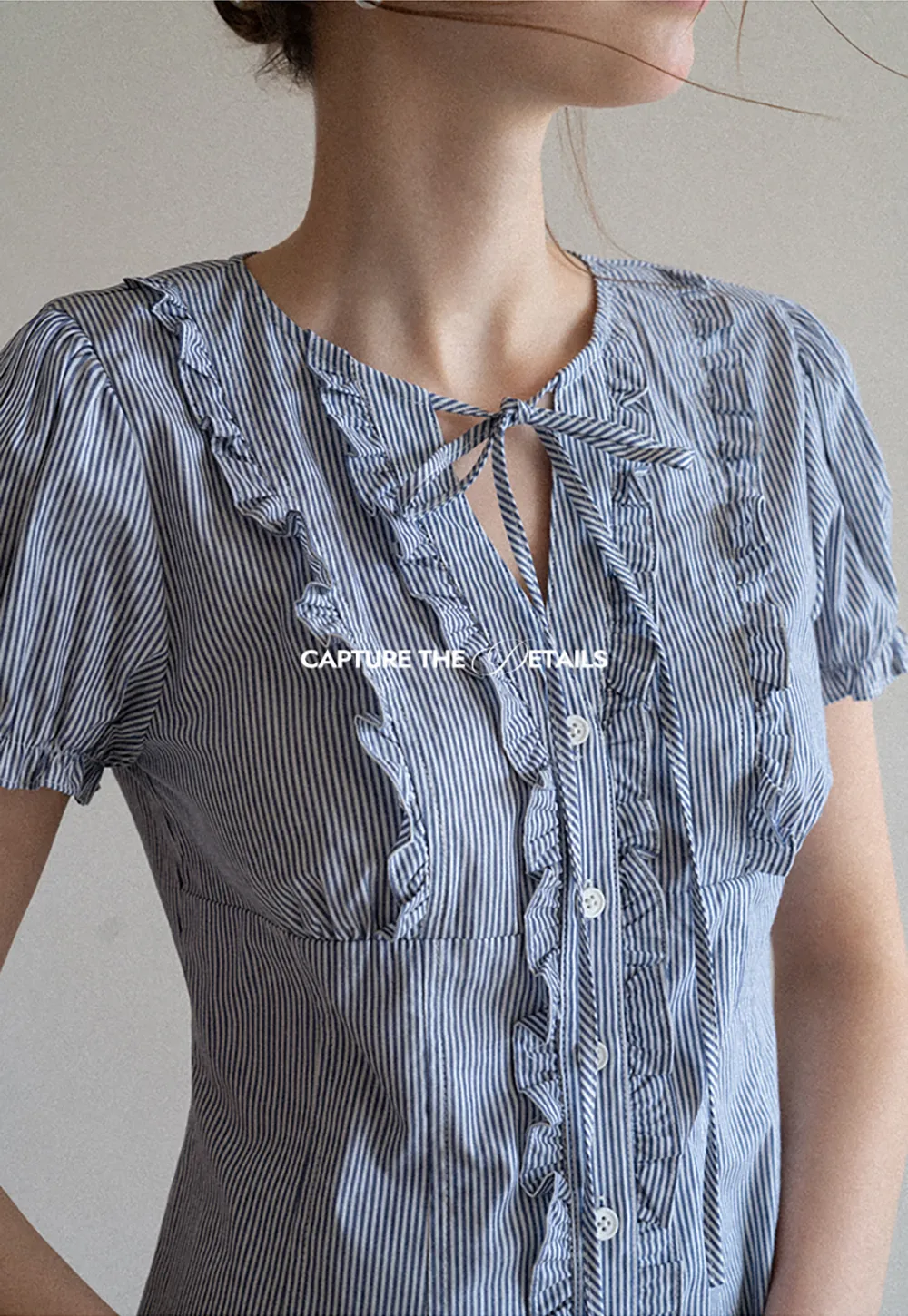 Striped short sleeve shirt with ruffles and tie front