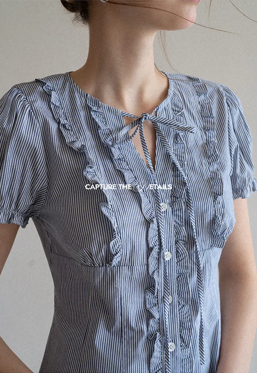 Striped short sleeve shirt with ruffles and tie front