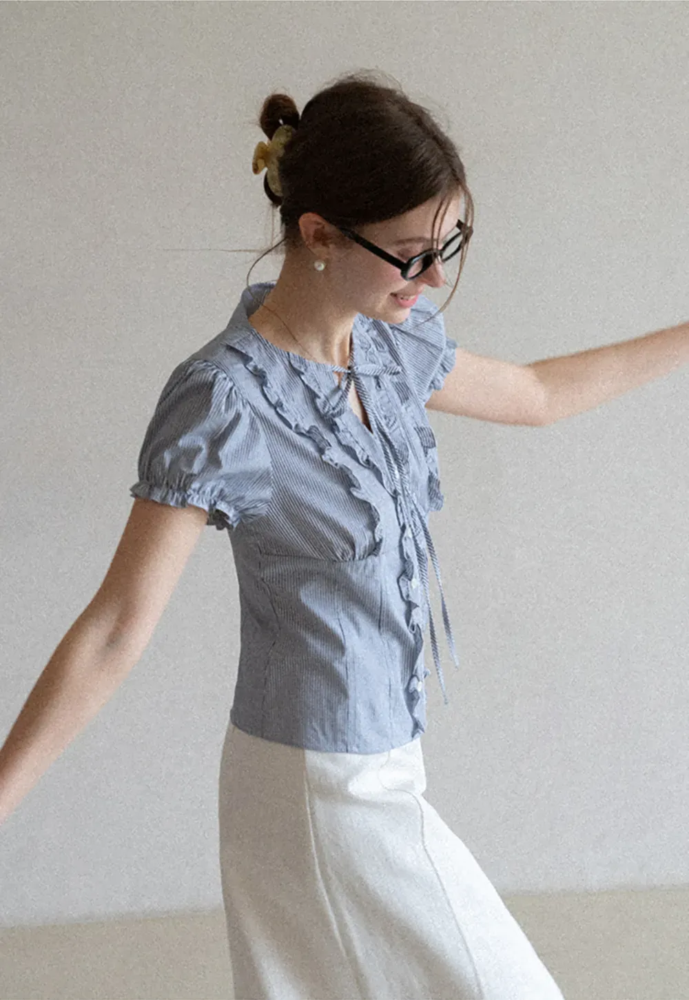 Striped short sleeve shirt with ruffles and tie front