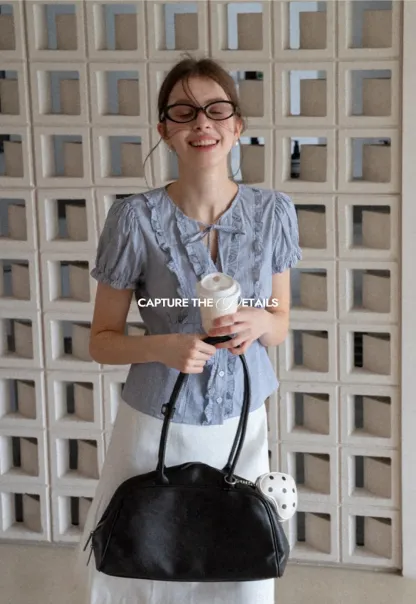 Striped short sleeve shirt with ruffles and tie front