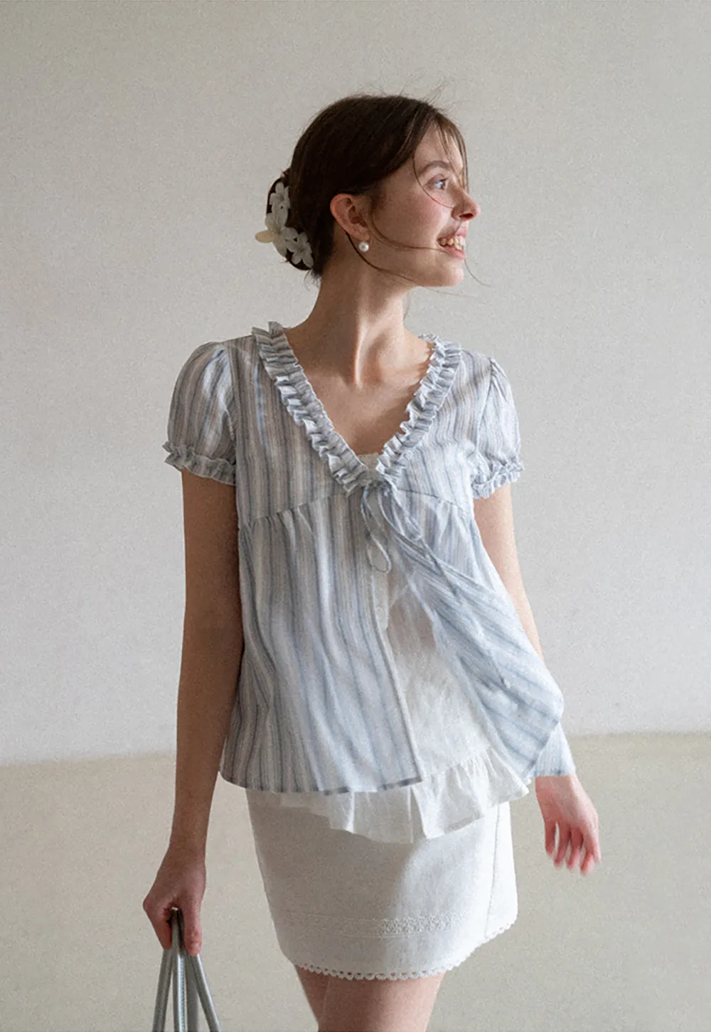 Striped short sleeve blouse with ruffled V neck