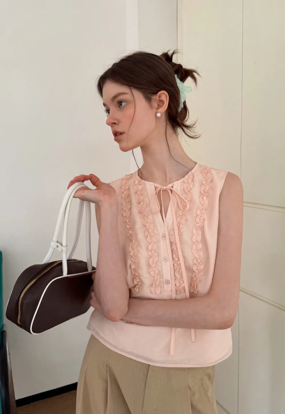 Ruffled Trim Sleeveless Shirt With Tie Neck Detail