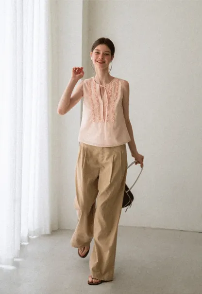 Ruffled Trim Sleeveless Shirt With Tie Neck Detail