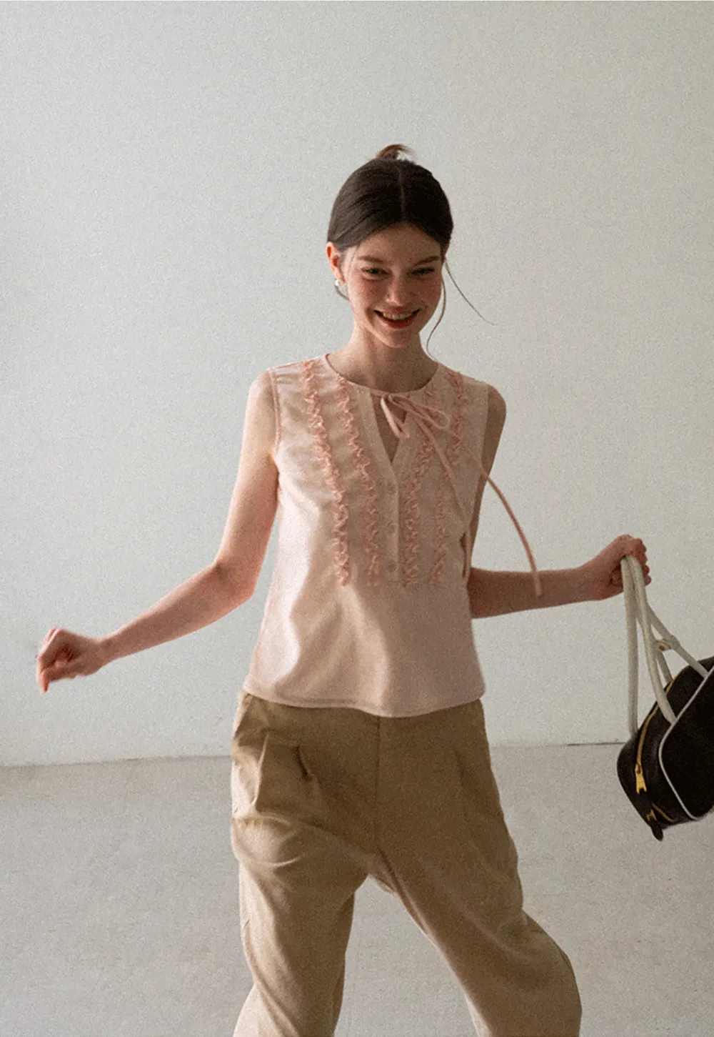 Ruffled Trim Sleeveless Shirt With Tie Neck Detail
