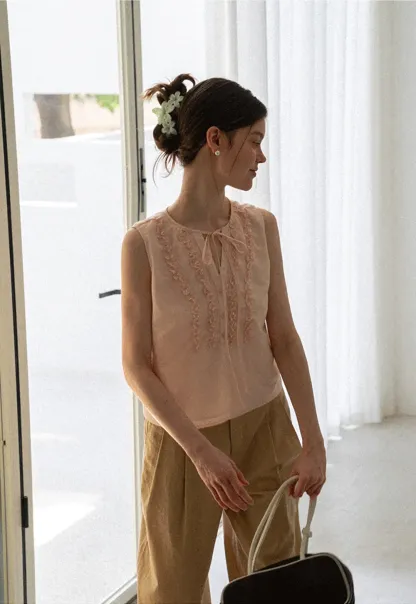 Ruffled Trim Sleeveless Shirt With Tie Neck Detail