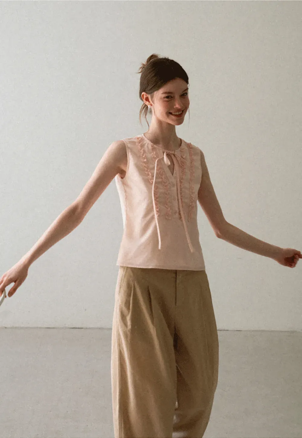 Ruffled Trim Sleeveless Shirt With Tie Neck Detail