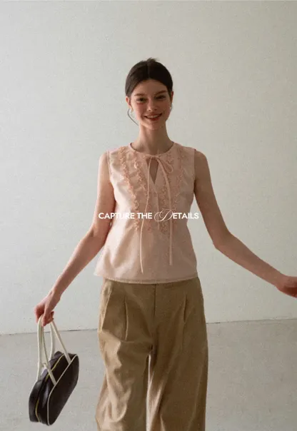 Ruffled Trim Sleeveless Shirt With Tie Neck Detail