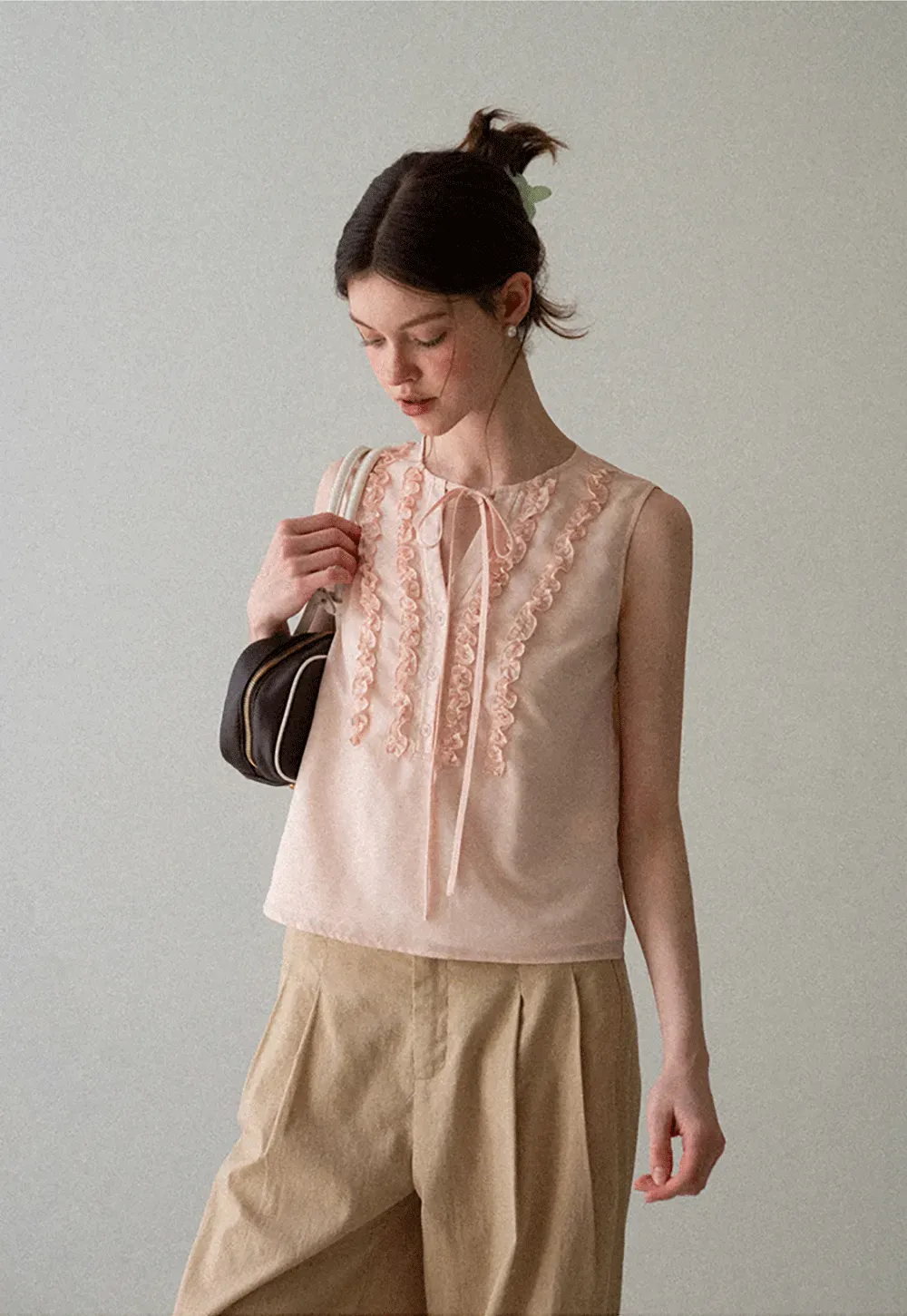 Ruffled Trim Sleeveless Shirt With Tie Neck Detail
