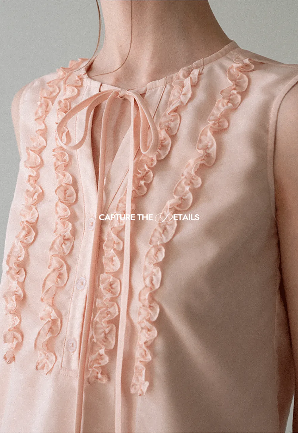 Ruffled Trim Sleeveless Shirt With Tie Neck Detail