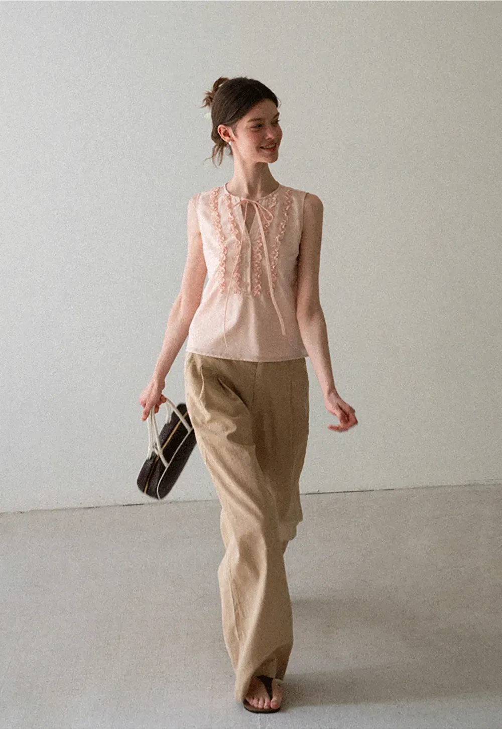 Ruffled Trim Sleeveless Shirt With Tie Neck Detail