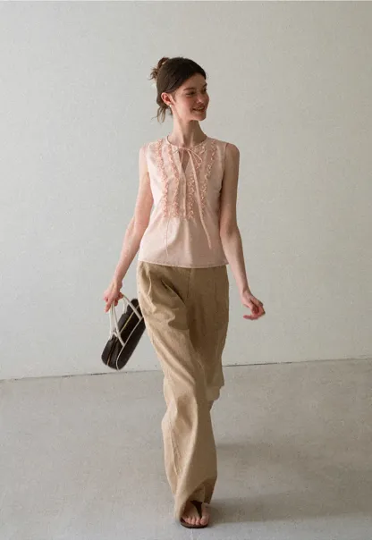 Ruffled Trim Sleeveless Shirt With Tie Neck Detail