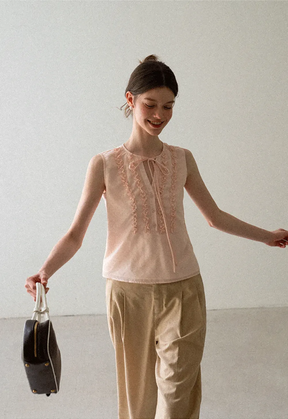 Ruffled Trim Sleeveless Shirt With Tie Neck Detail