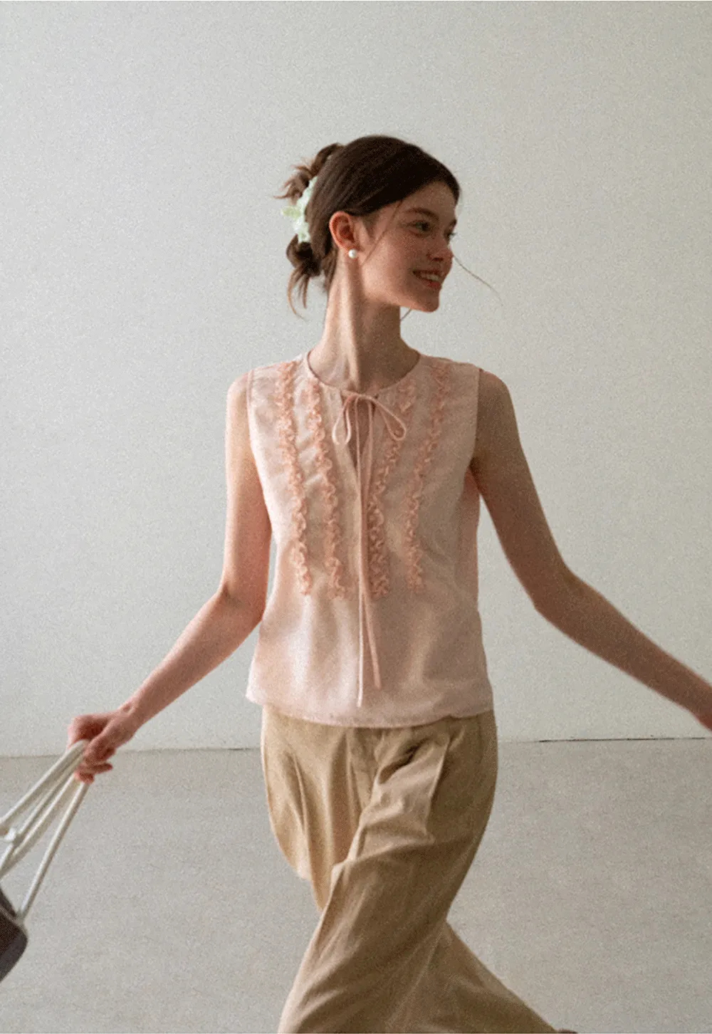Ruffled Trim Sleeveless Shirt With Tie Neck Detail