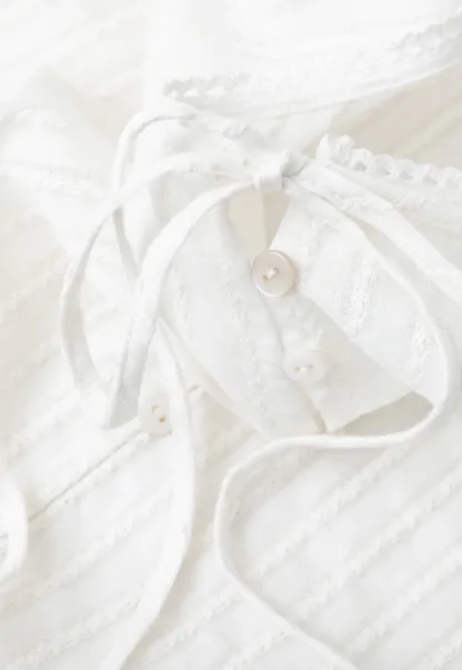 Pleated Short Sleeve Blouse with Ruffled Neckline