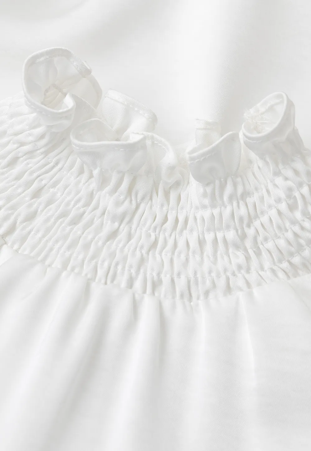 Smocked High Neck Ruffled Cuff Blouse