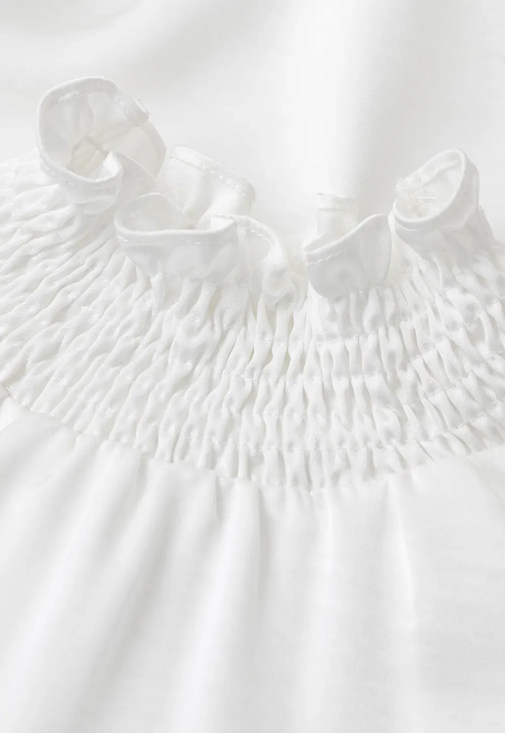 Smocked High Neck Ruffled Cuff Blouse