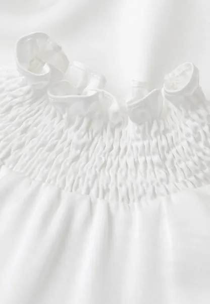 Smocked High Neck Ruffled Cuff Blouse