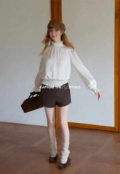 Smocked High Neck Ruffled Cuff Blouse