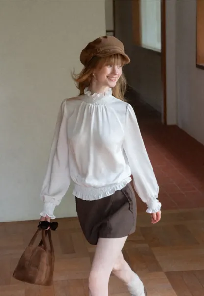 Smocked High Neck Ruffled Cuff Blouse