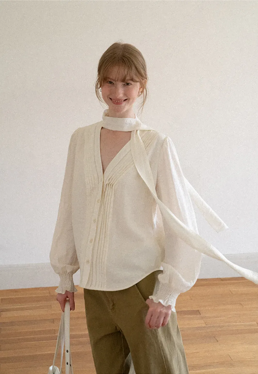 Pleated V Neck Button Up Shirt with Ruffled Cuff