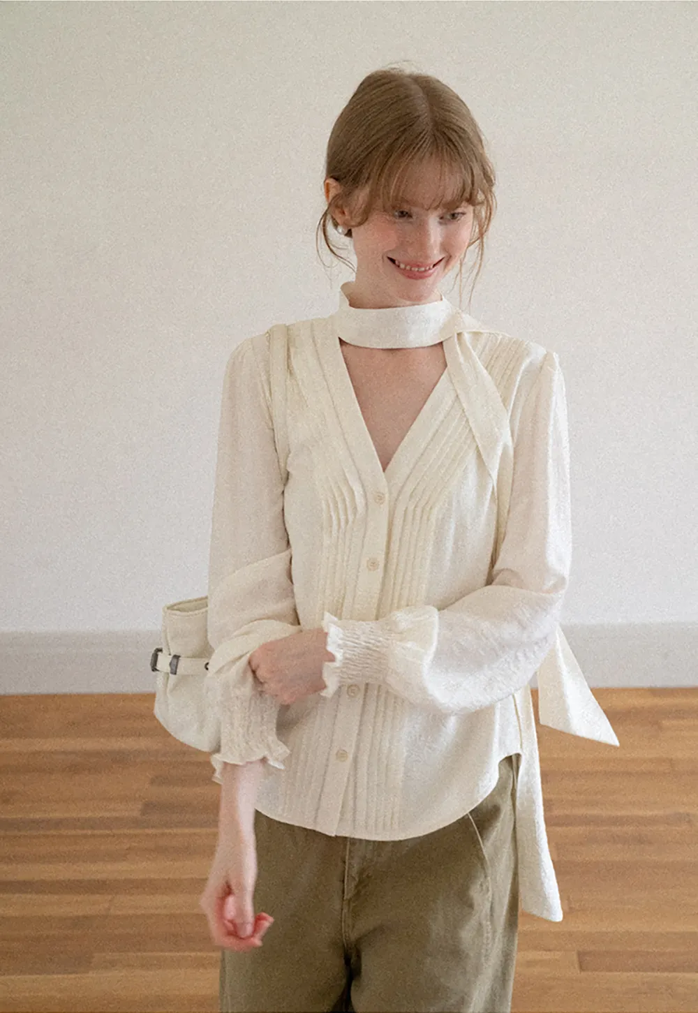 Pleated V Neck Button Up Shirt with Ruffled Cuff