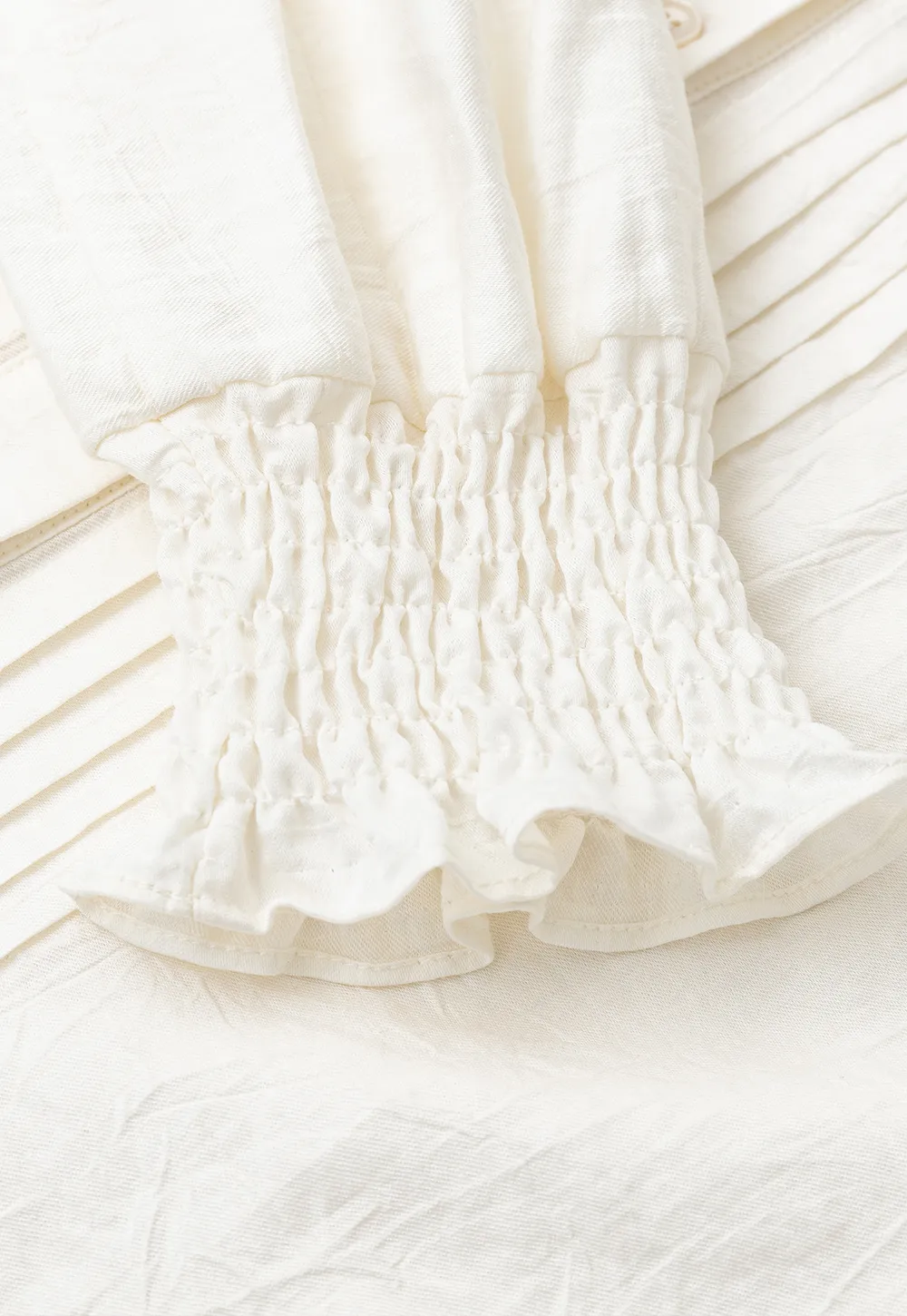 Pleated V Neck Button Up Shirt with Ruffled Cuff