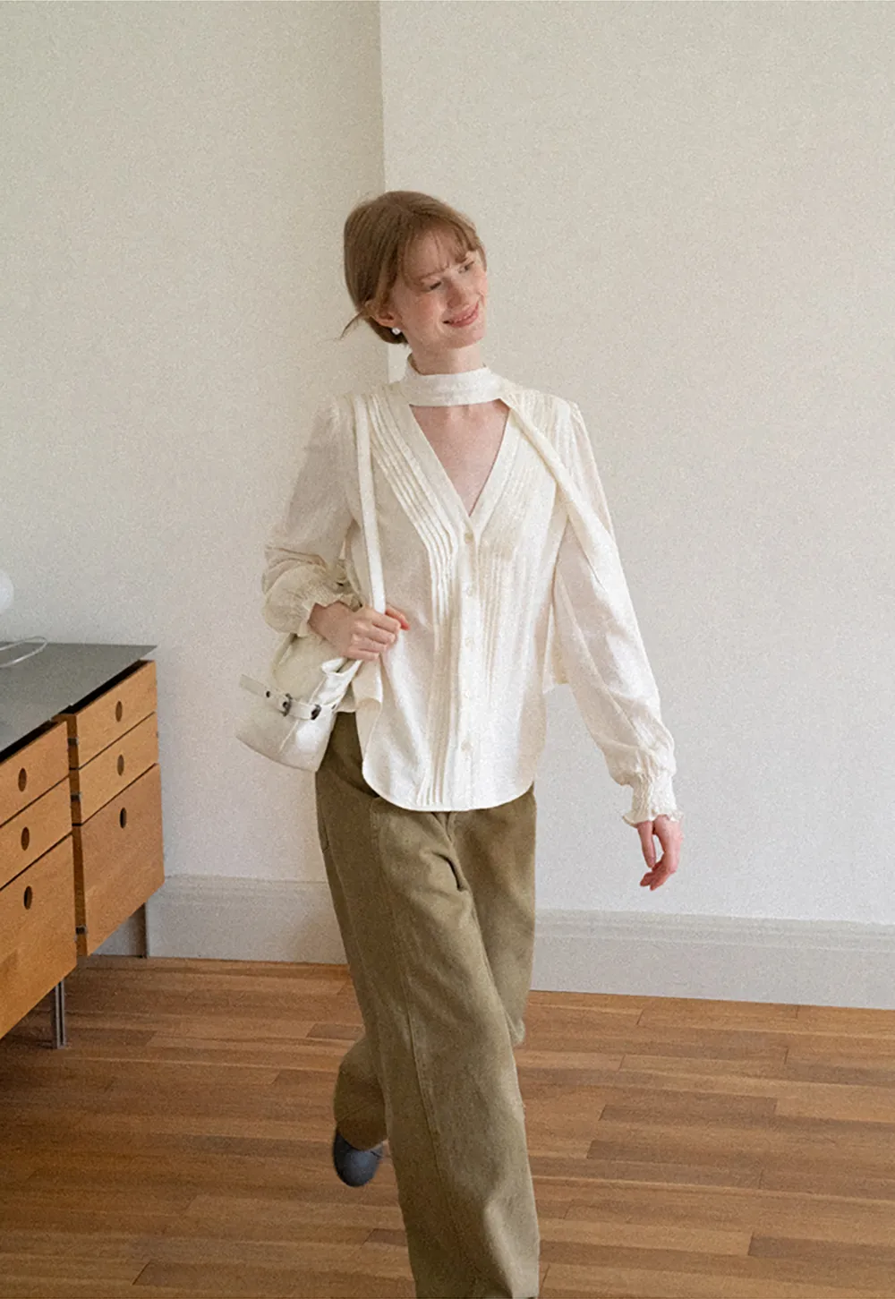 Pleated V Neck Button Up Shirt with Ruffled Cuff