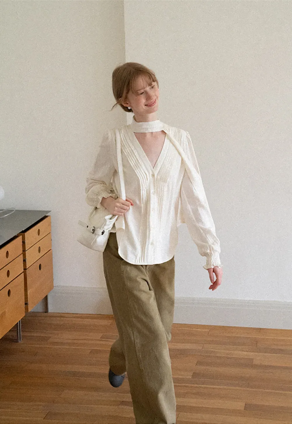 Pleated V Neck Button Up Shirt with Ruffled Cuff