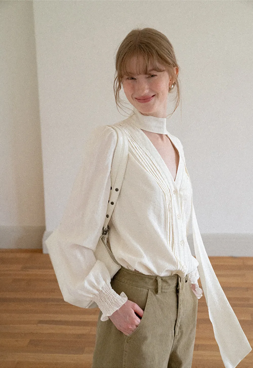 Pleated V Neck Button Up Shirt with Ruffled Cuff