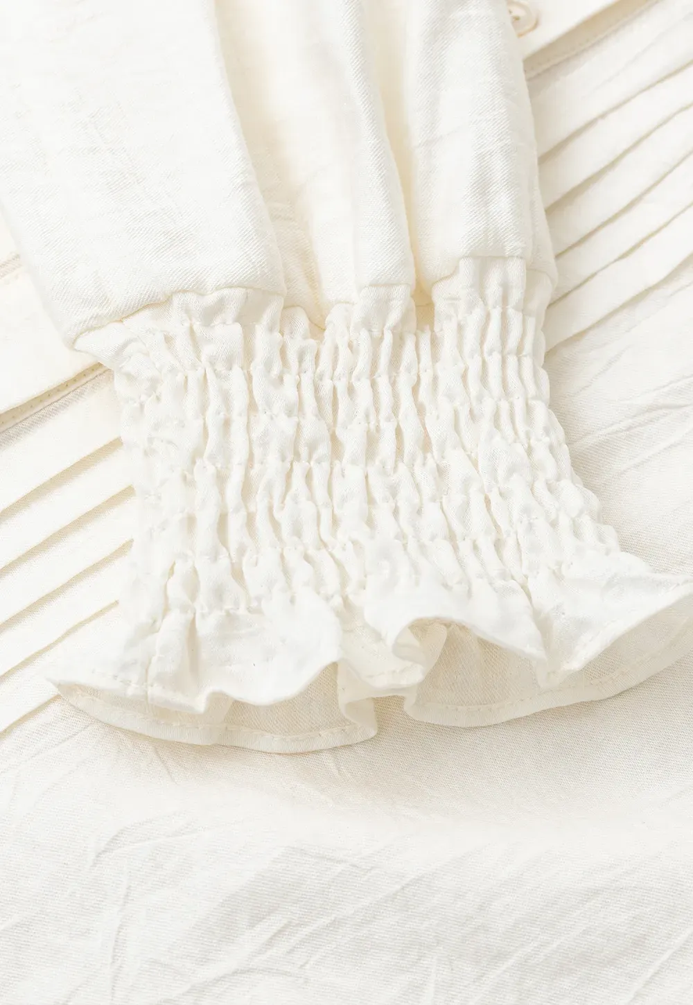 Pleated V Neck Button Up Shirt with Ruffled Cuff
