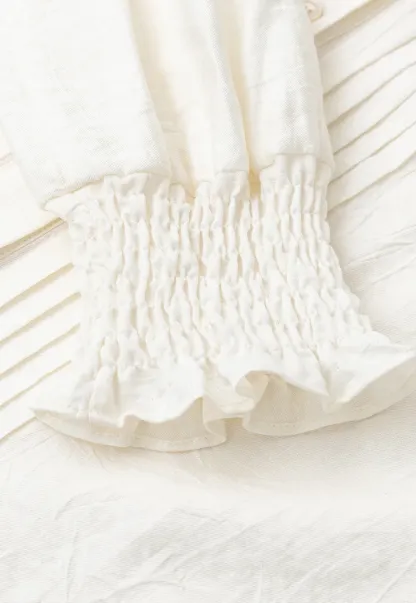 Pleated V Neck Button Up Shirt with Ruffled Cuff