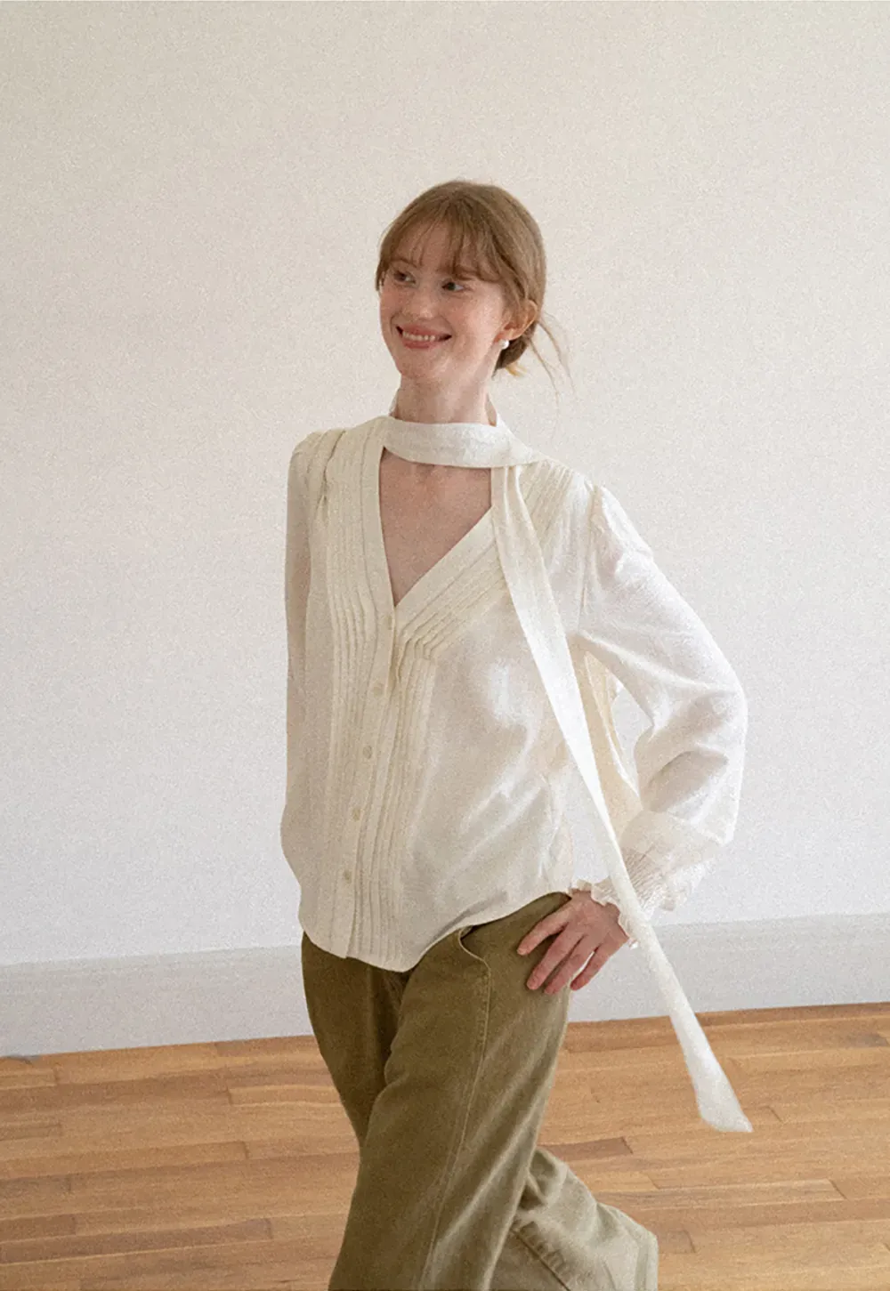 Pleated V Neck Button Up Shirt with Ruffled Cuff